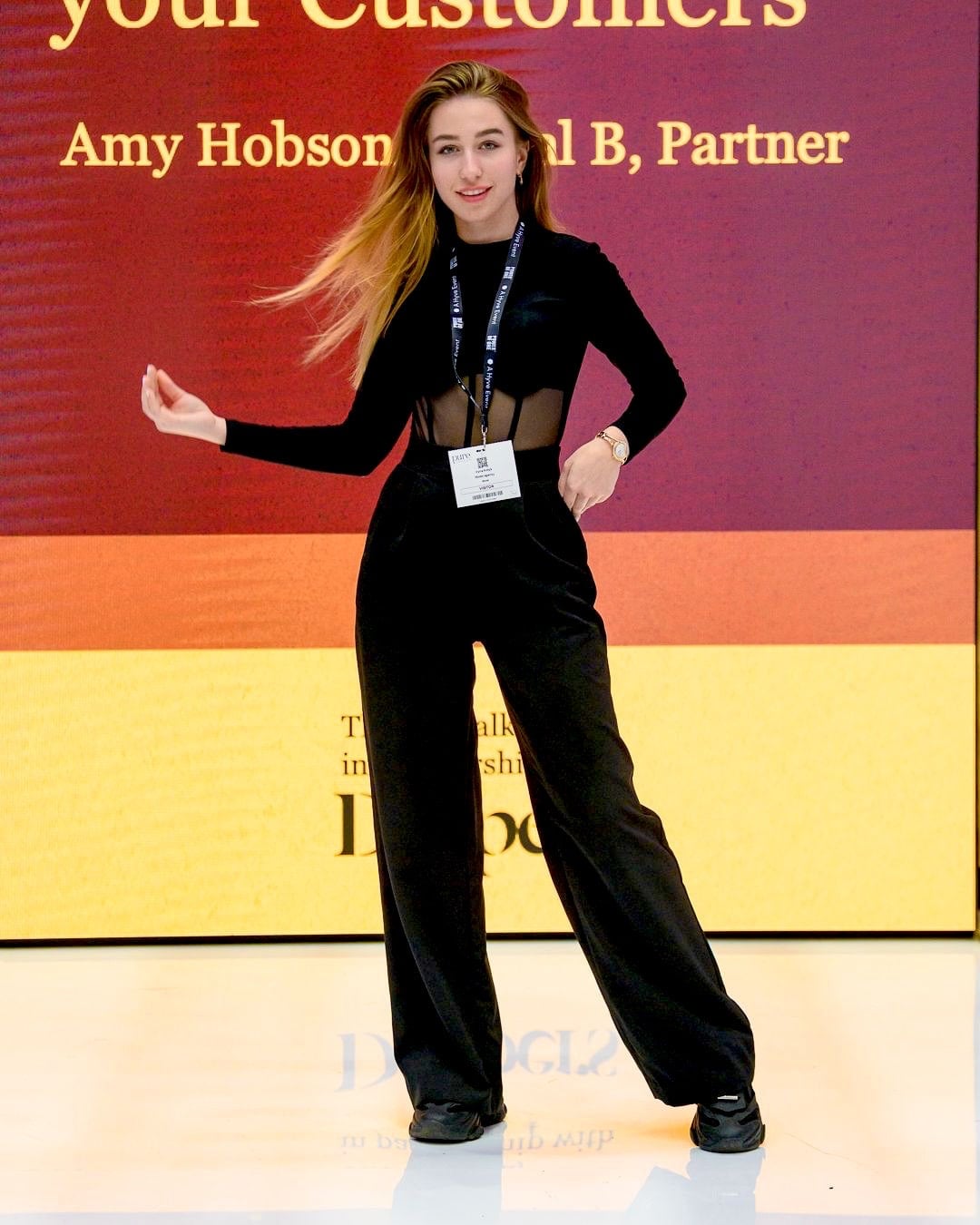 Vyacheslavivna posing in a black tailored look at a fashion event