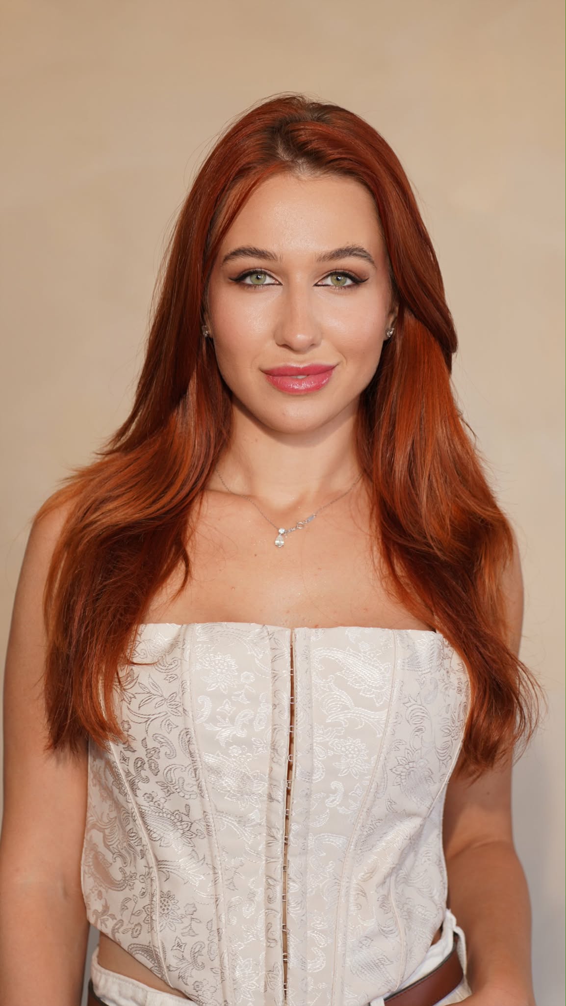 Studio portrait of Iryna Vyacheslavivna wearing a white corset top